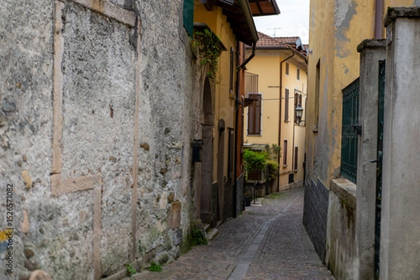 Obraz Ancient stone arches, weathered walls, medieval charm, Italian old town atmosphere, timeless travel destination region Piedmont, Old European district