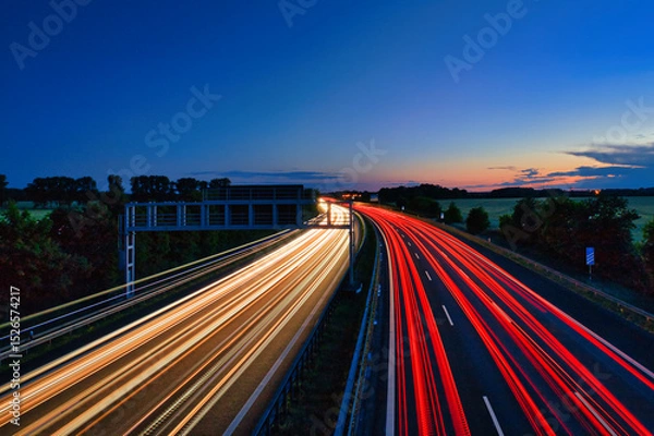 Fototapeta Langzeitbelichtung - Autobahn - Strasse - Traffic - Travel - Background - Line - Ecology - Highway - Long Exposure - Motorway - Night Traffic - Light Trails - High quality photo
