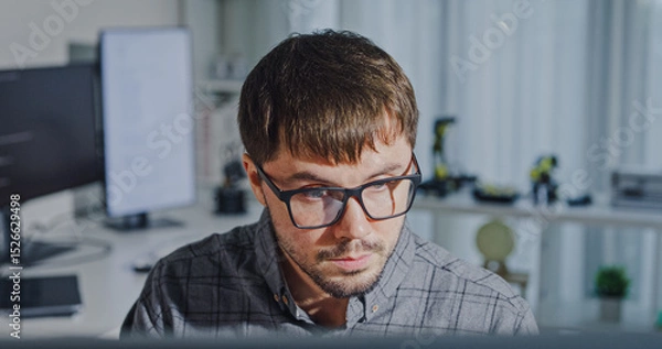 Fototapeta Closeup young adult male freelance developer typing write prompt AI bot app program nomad terminal with coding at office. Artificial intelligence dashboard, robotics, user interface, machine learning.