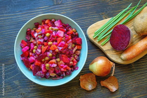 Fototapeta Vinaigrette, vegetable salad based on beets. Ingredients on a cutting board, flat lay, copy space