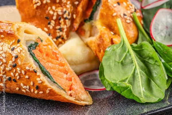 Obraz Baked salmon en croute with spinach, sesame crust, mashed potatoes, and fresh greens.