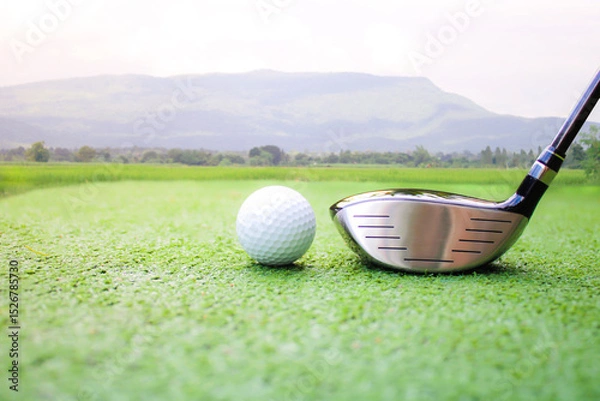 Fototapeta Close-Up of Golf Club and Ball on Green Grass with Scenic Background
