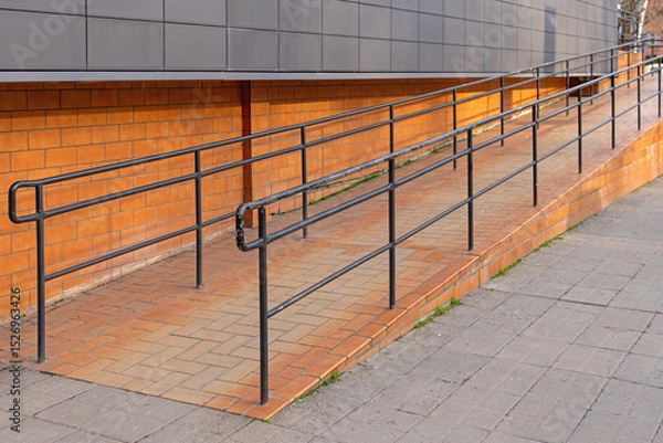 Fototapeta Tiled Ramp for Wheelchair User Access With Metal Fence