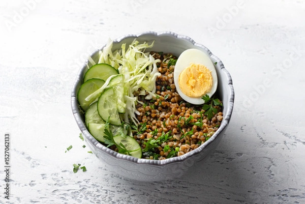 Obraz Nutritious Buckwheat Bowl with Fresh Cucumber, Cabbage, and Egg