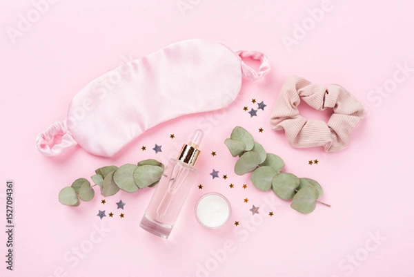 Fototapeta Sleeping mask with accessories on color background, top view. Sleeping routine concept