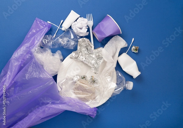 Fototapeta Bag with unsorted waste on color background, top view