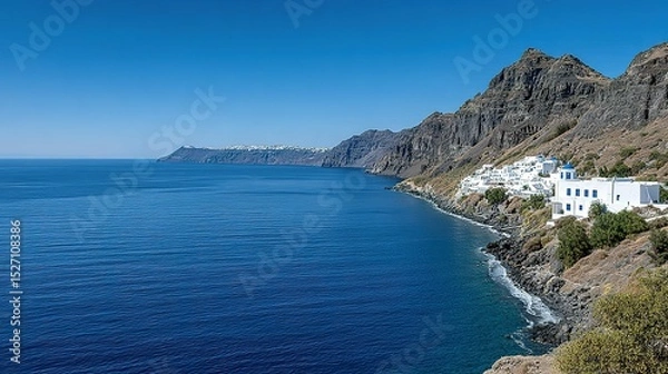 Obraz Scenic coastal view of white buildings nestled on a volcanic hillside.
