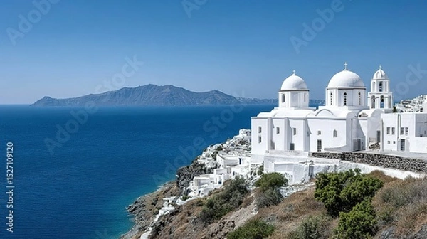 Obraz Whitewashed churches on a hillside overlooking the sea.