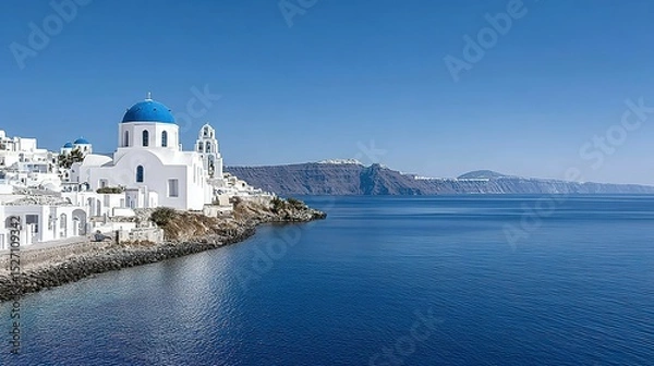 Obraz Mediterranean coastal scenery with white buildings and a calm sea.