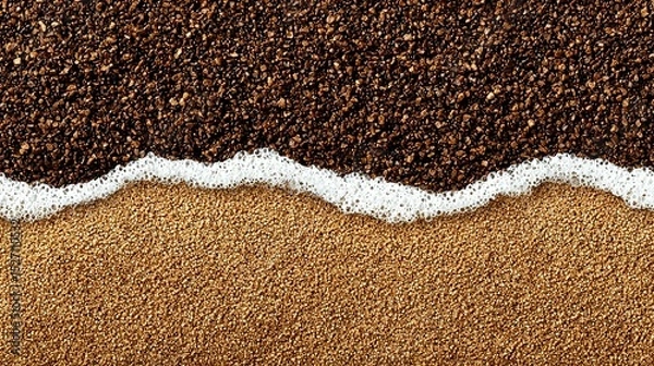 Obraz Coffee grounds and sand with a foamy wave line.