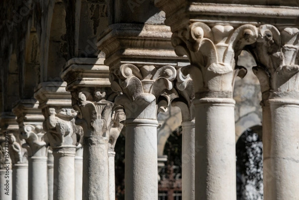 Obraz Closeup of columns of the monastery of Chiostro di Sant'Andrea in Genoa, Italy