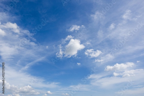 Fototapeta clear blue sky background,clouds with background, Blue sky background with tiny clouds. White fluffy clouds in the blue sky. 