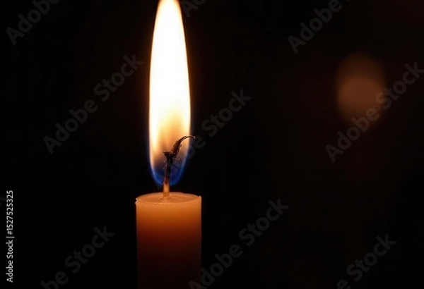 Obraz Candle flame illuminating darkness: study in light shadow