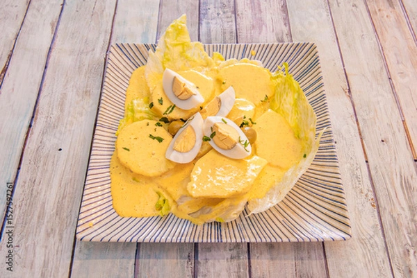 Fototapeta It consists of a yellow cream based on fresh cheese and yellow chili pepper, evaporated milk and oil are added to form the semi-liquid consistency it requires