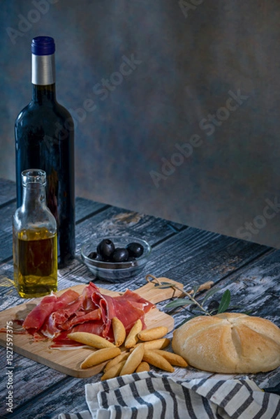 Fototapeta Offering Serrano ham to a guest is a gesture of welcome and hospitality