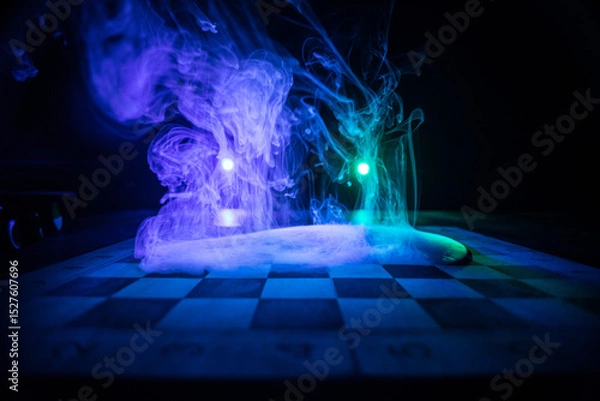 Fototapeta Chess board game concept of business ideas and competition. Chess figures on a dark background with smoke and fog.
