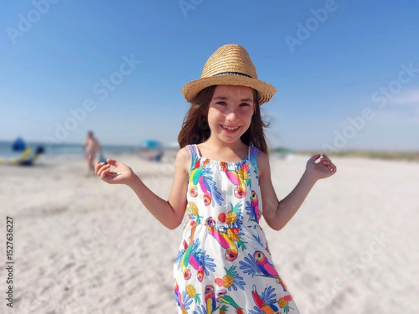 Obraz Portrait of adorable young girl on the beach in summer dress and hat
