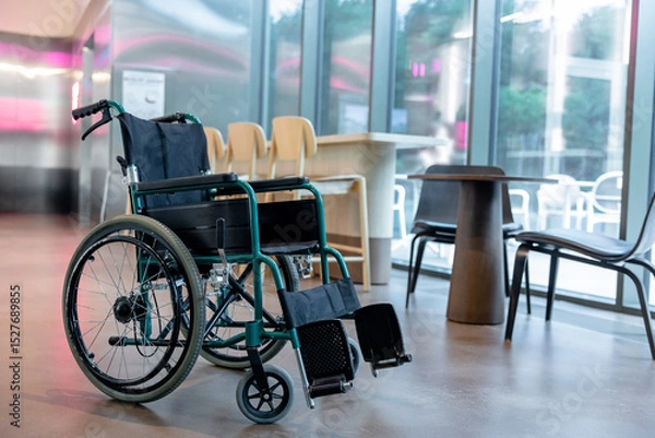 Fototapeta Picture of a wheelchair in the middle of the room