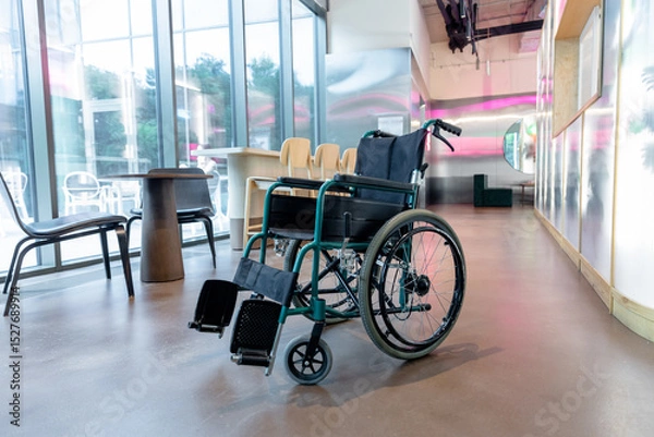 Fototapeta Picture of a wheelchair in the middle of the room