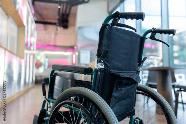 Fototapeta Picture of a wheelchair in the middle of the room