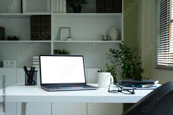 Obraz Laptop computer blank screen with clipping path on table. Workspace concept.