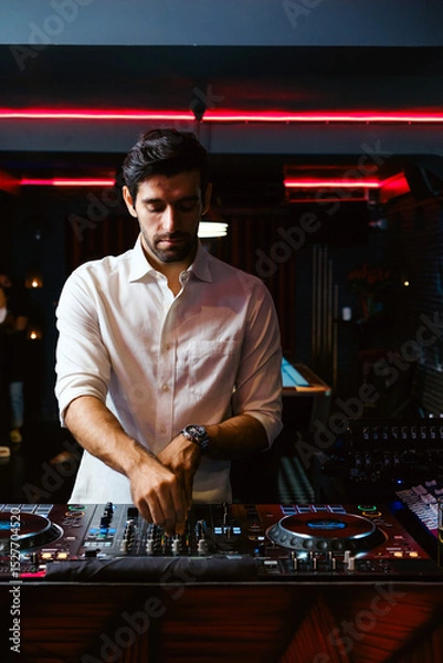Fototapeta DJ performing in a nightclub with neon lights, setting the mood for a vibrant girls’ night out. Ideal for nightlife, party, and entertainment content emphasizing modern diversity and dance culture.