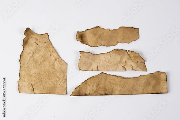 Fototapeta Recycled paper on a white background. Brown paper torn or ripped pieces of paper isolated on white background.
