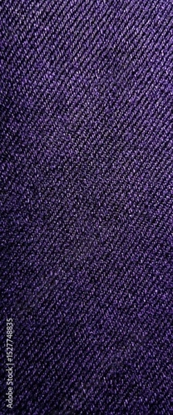 Obraz A textured fabric with a deep, dark hue, showcasing intricate patterns that create a visually appealing surface.