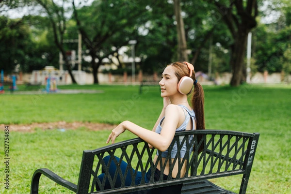Fototapeta Relaxing outdoor workout routine city park fitness lifestyle green environment side view health and wellness