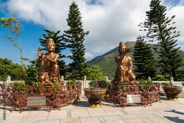 Fototapeta Lantau Island, Hong Kong 10-20-2024 The amazing bronze statue of Tian Tan Buddha or Big Buddha in the village of Ngong Ping, which is one of Hong Kong most popular tourist attractions at Lantau Island