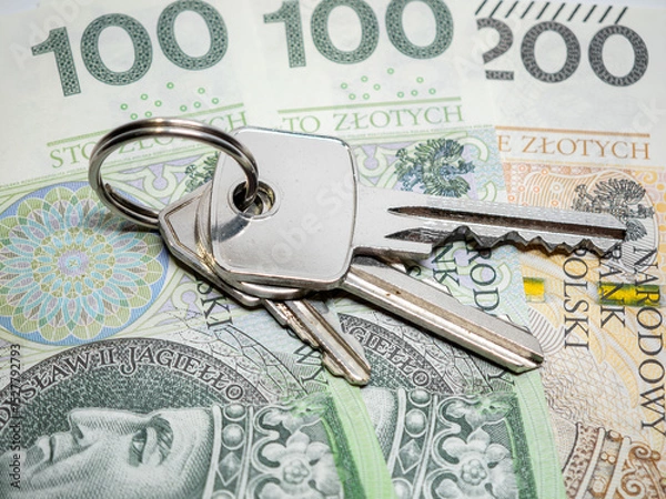 Obraz Pęk kluczy od mieszkania leży na pieniądzach, polskie pln. Wynajem zakup mieszkania koncept