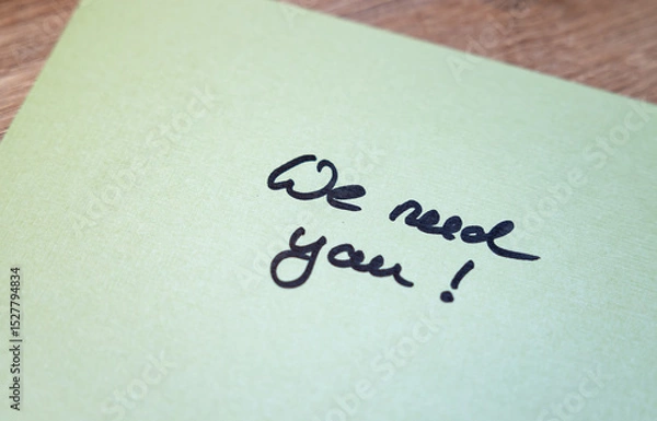 Fototapeta We need you! Green note with handwritten text. Opportunity, hiring, applying, searching, job search, recruitment.