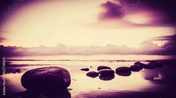Obraz Purple sunset over a calm sea with rocks emerging from the water surface