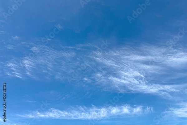 Obraz Light white clouds on bright blue gradient sky, background, backdrop, screensaver, screen, desktop.