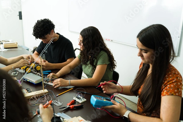 Obraz High school students working on electronics project in stem class