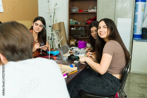 Obraz Group of high school students working on electronics project