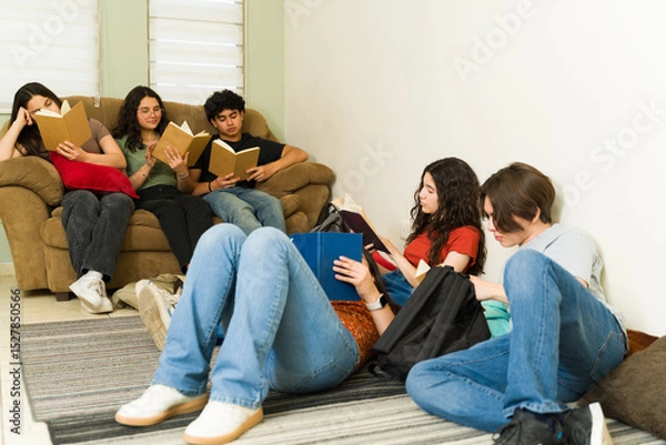 Obraz Group of students reading comfortable in school library