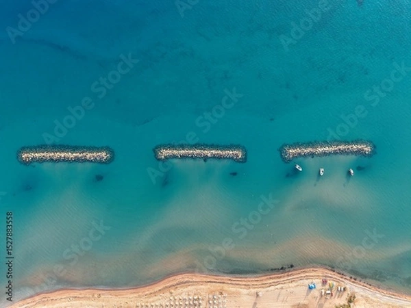 Fototapeta Aerial View of Coastal Rock Formation Above Turquoise Sea