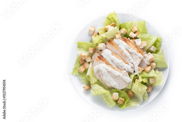 Fototapeta Crunchy Caesar salad with chicken isolated on white background. Top view. Copy space