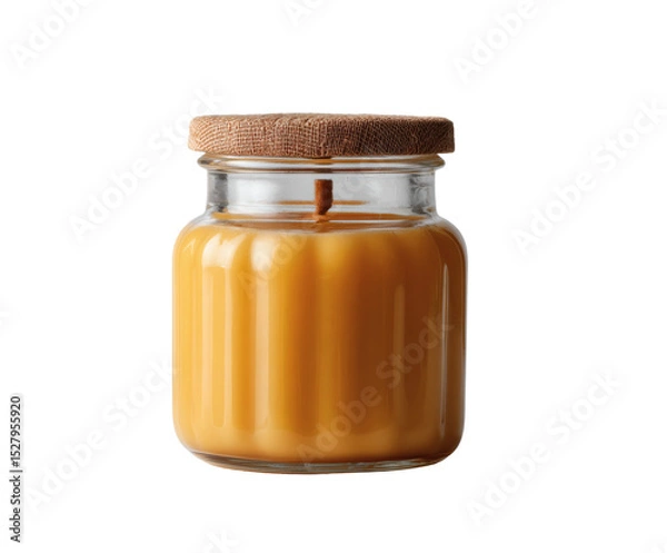 Obraz An amber candle sits in a glass jar, creating a warm and inviting ambiance.