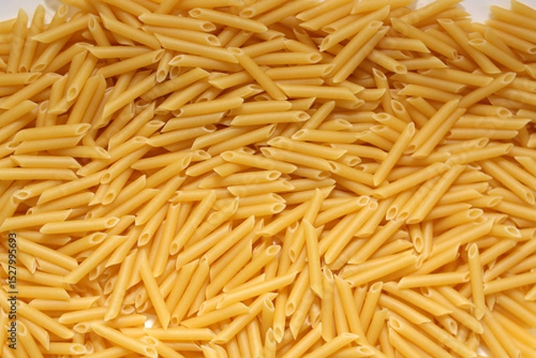 Obraz Uncooked Penne Pasta. Dry Pasta. Raw Macaroni - Top View, Flat Lay.