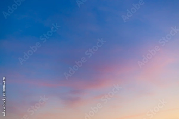 Fototapeta Colorful sky backdrop in the morning,Nature beautiful Light Sunset or sunrise sky,Sunset Sky Background in the Evening with Dramatic Dusk Clouds and Colorful Pink, Orange Sunlight on Blue Twilight sky