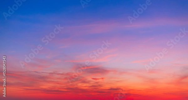 Fototapeta Colorful sky backdrop in the morning,Nature beautiful Light Sunset or sunrise sky,Sunset Sky Background in the Evening with Dramatic Dusk Clouds and Colorful Pink, Orange Sunlight on Blue Twilight sky