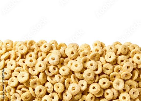 Fototapeta Whole grain cereal rings in a white background, close up, top view. Crispy cereal loops in a white background.
