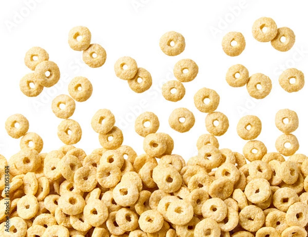 Fototapeta Whole grain cereal rings scattered in a white background, top view.