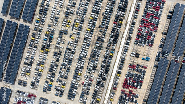 Fototapeta Aerial top view of car park with solar panel photovoltaic, Solar panel photovoltaic installation on roof of car parking lot, Alternative electricity source sustainable resources.