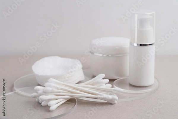 Fototapeta Container for cream, shampoo, toiletries, spa. Unbranded white plastic bottles. Bottle with a dispenser for cosmetic products. Skin care and beauty concept. Mockup style, copy space