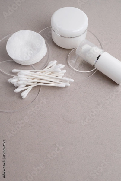 Fototapeta Container for cream, shampoo, toiletries, spa. Unbranded white plastic bottles. Bottle with a dispenser for cosmetic products. Skin care and beauty concept. Mockup style, copy space