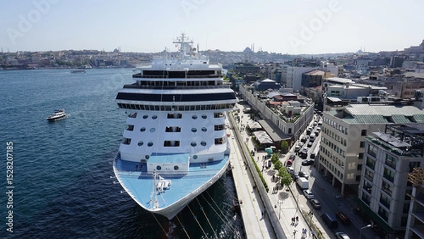 Fototapeta Istanbul, Turkey - Galataport waterfront in Karakoy with a view of the city skyline