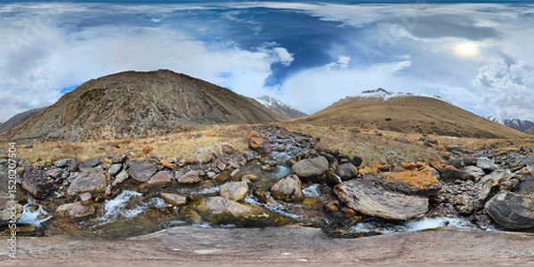 Fototapeta A 360 by 180 degrees equirectangular panorama of Mountain river with rocks at springtime in mountain gorge at sunny afternoon